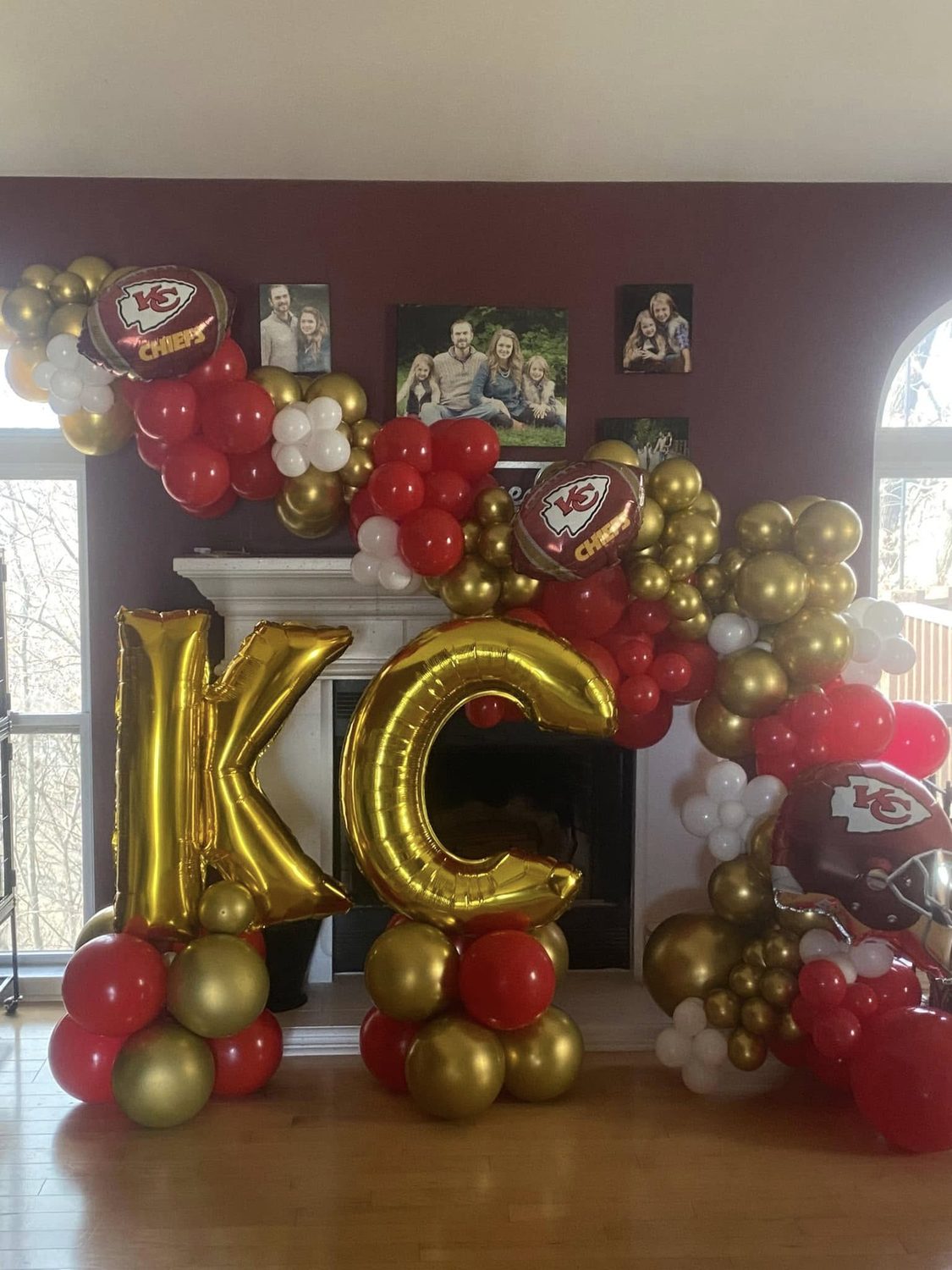 Kansas City Chiefs themed balloon fireplace with gold K and C letters